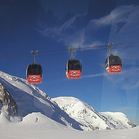gondolas in alps - ariel wants a chip.